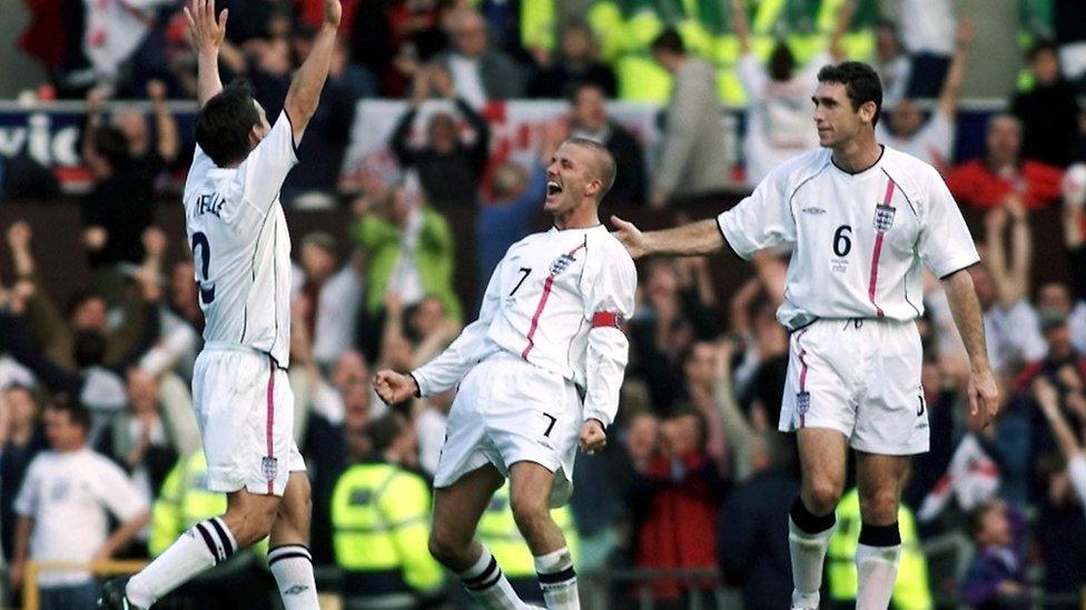 David Beckham (centre) celebrates with Gary Neville (left) and Martin Keown (right) after taking England to the 2002 World Cup with a last minute freekick against Greece.