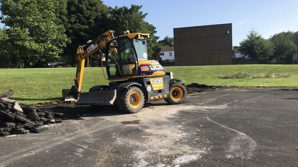 Digger at basketball court