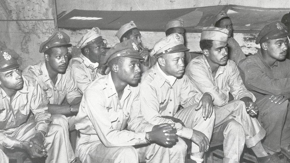 World War II pilots being briefed to fly a mission over Italy