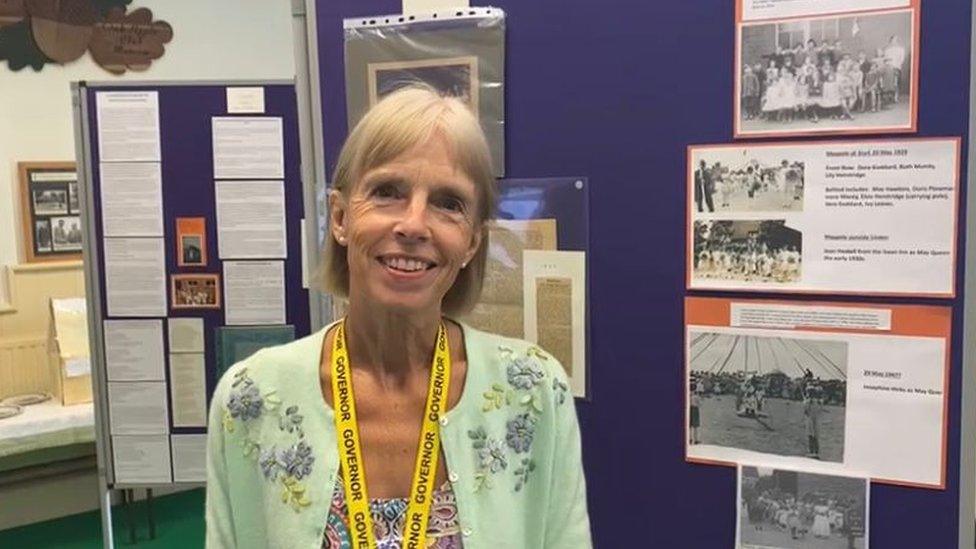 Sue Bale, Chair of Governors, stands in front of the historical display