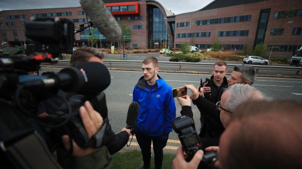 Tom Evans with reporters