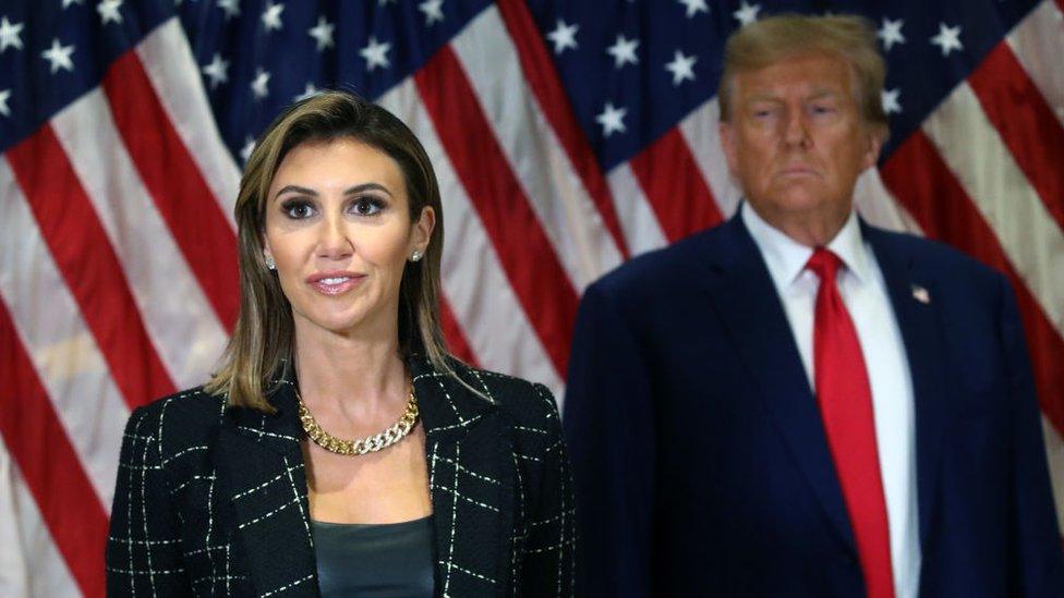 Alina Habba speaks as Donald Trump looks on