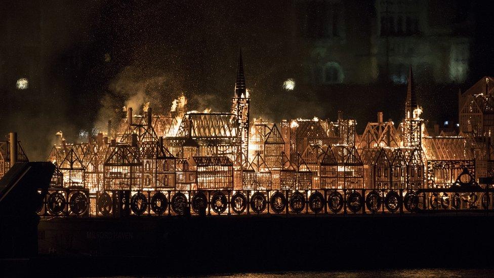 A model of London's skyline set alight