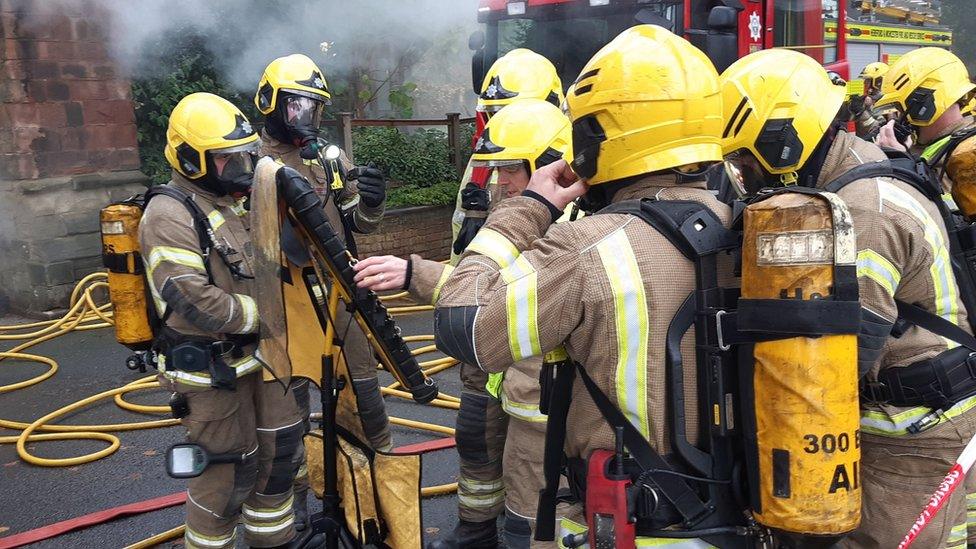 Firefighters having a discussion