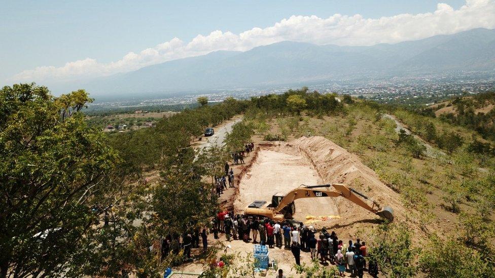 A view of a mass grave for victims of the earthquake and tsunami near Palu, Central Sulawesi,