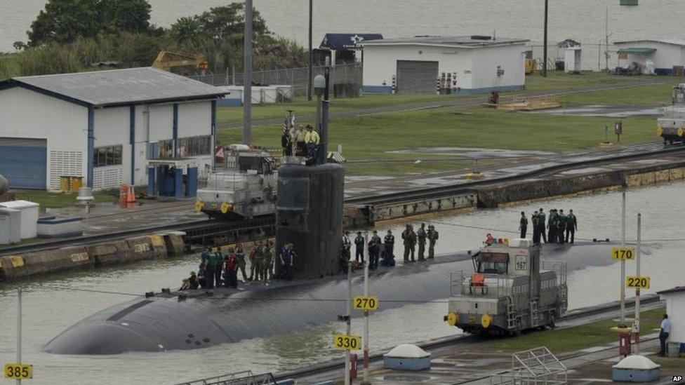 US Navy submarine USS Columbus sails through the Miraflores locks at the Panama Canal in Panama City on 10 July, 2015.