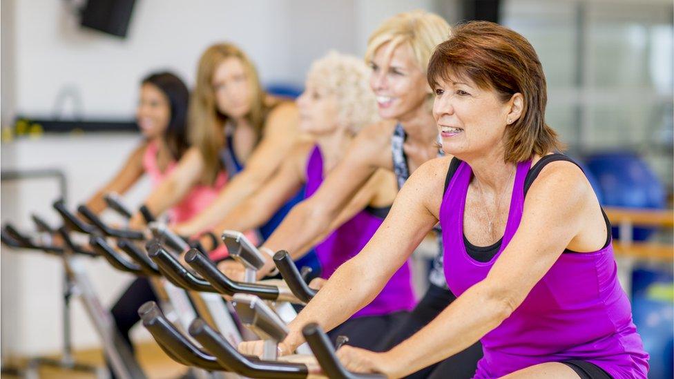 Women on exercise bikes