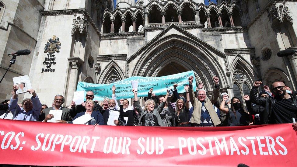 Former post office workers celebrate outside the Royal Courts of Justice, London, after having their convictions overturned by the Court of Appeal.