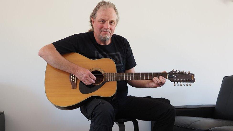 Mark Barrett with Syd Barrett's guitar