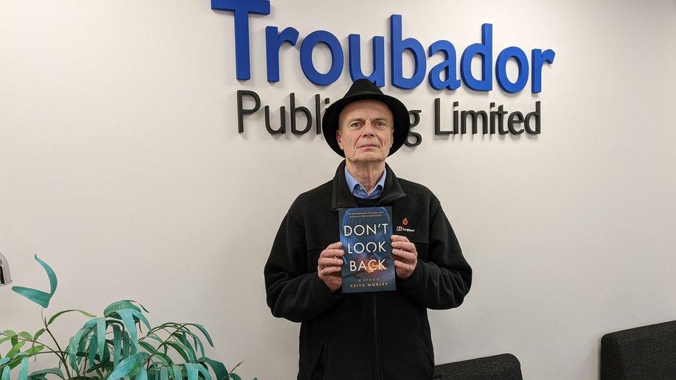 Keith Morley with his book