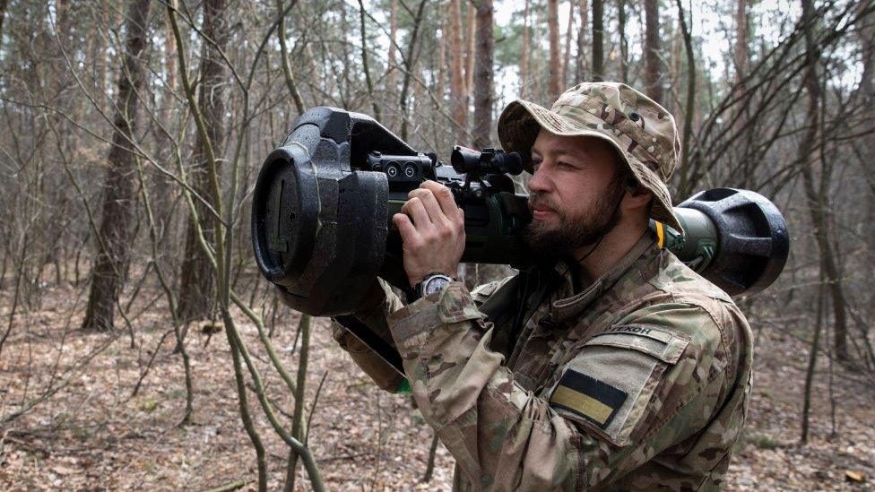 Ukraine soldier demonstrates anti-tank weapon