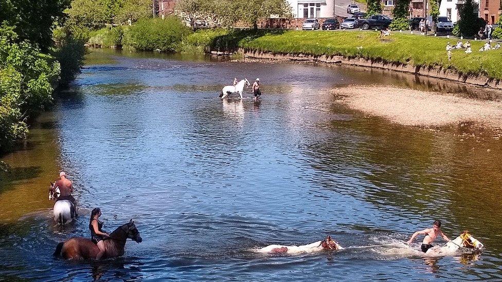 People and horses in Appleby