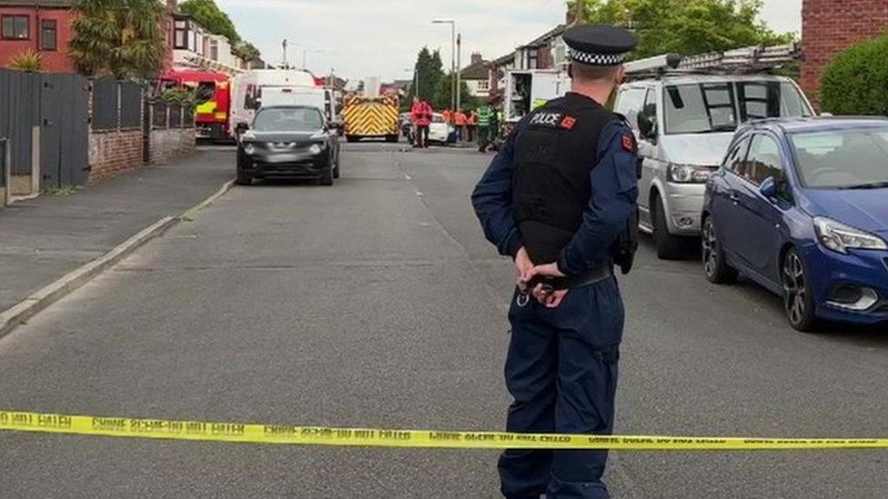 Police officer inside cordon in Reddish