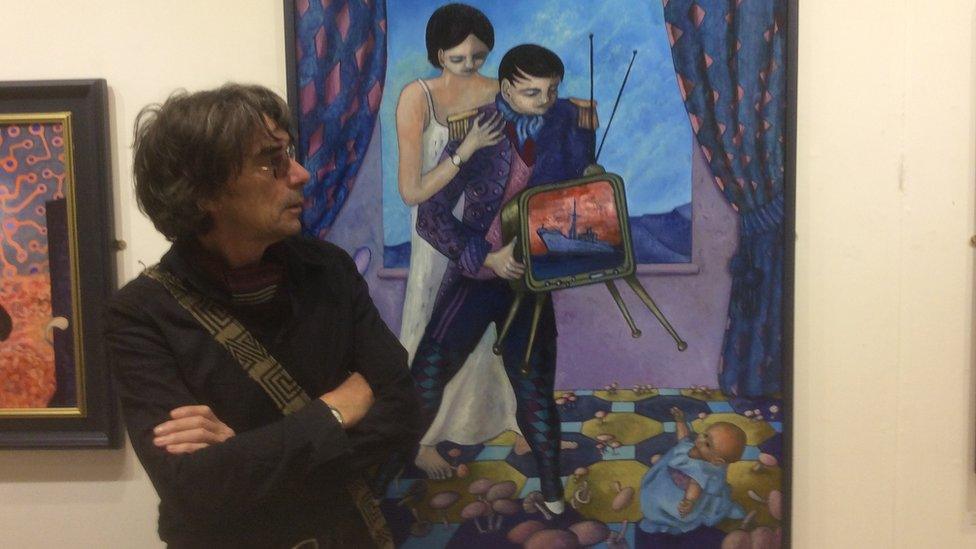 Ceri Pritchard with one of his paintings