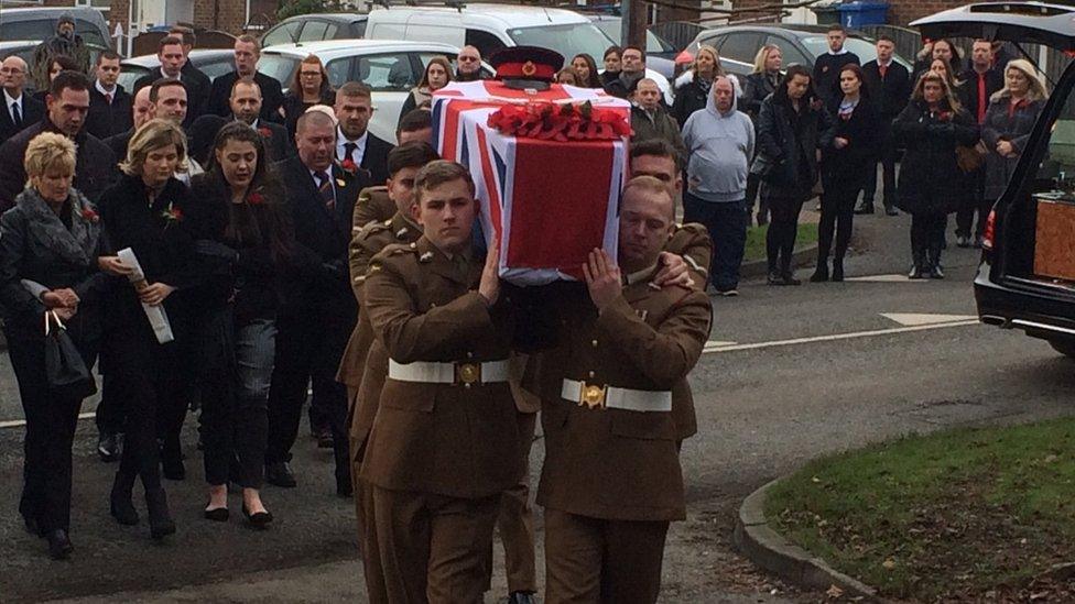 The coffin of L/Cpl Scott Hetherington carried by fellow members of his battalion.