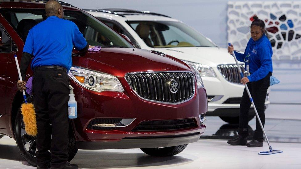 Man polishing Buick Enclave