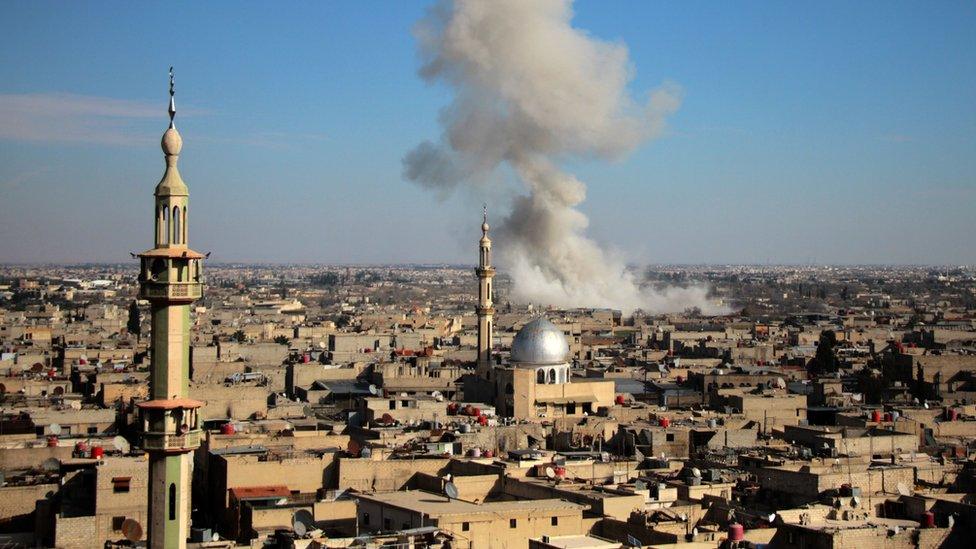 Smoke rises from the town of Misraba following a reported government air strike (19 February 2018)