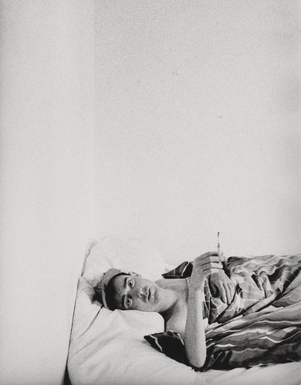 Stephen Linard lies in bed, c.1982–83