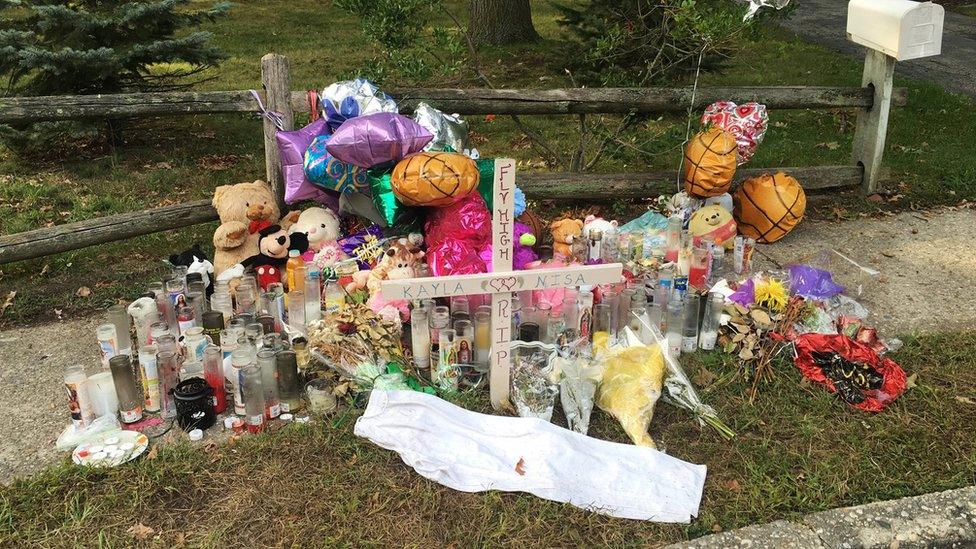 A memorial to Nisa Mickens and Kayla Cueva is seen near the spot where their bodies were found in Brentwood