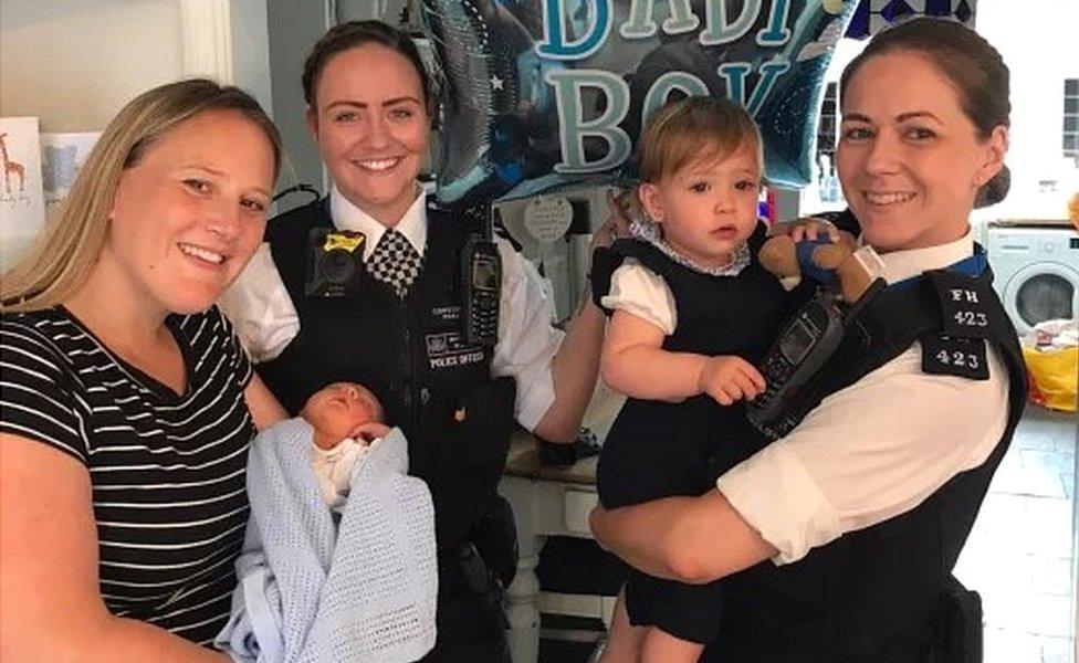 Rebecca Fox holding baby Bobby, PC Holly Foran and PC Nicola Devlin with Bobby's sister Marnie