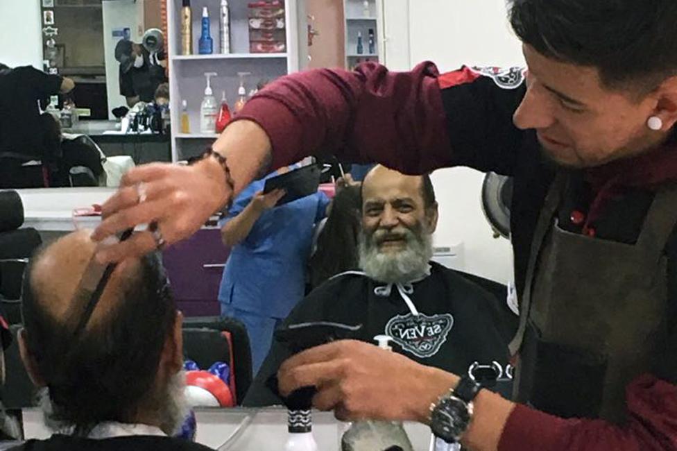 Natalia's uncle, Edgar, having his hair cut after getting his new teeth