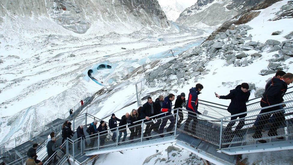 Emmanuel Macron visists Mer de Glace glacier with scientists and ministers