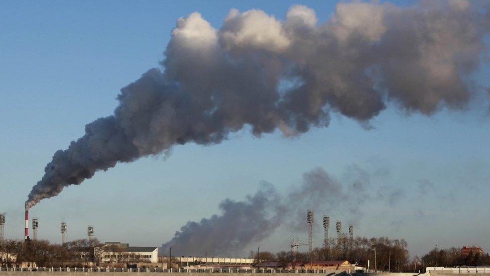 Smoke belches out from a heating factory in Heihe, north-eastern China, 22 November 2015