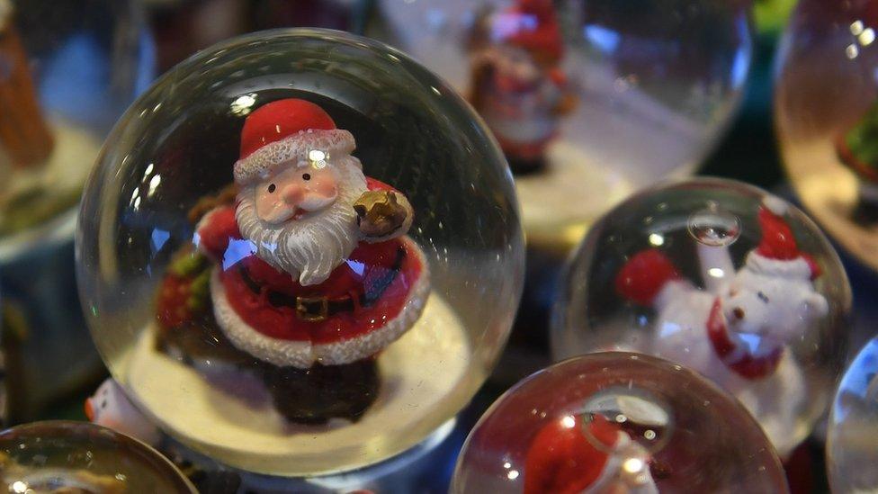 Christmas themed snow globes are for sale at the traditional Christmas Market in Nuremberg, southern Germany