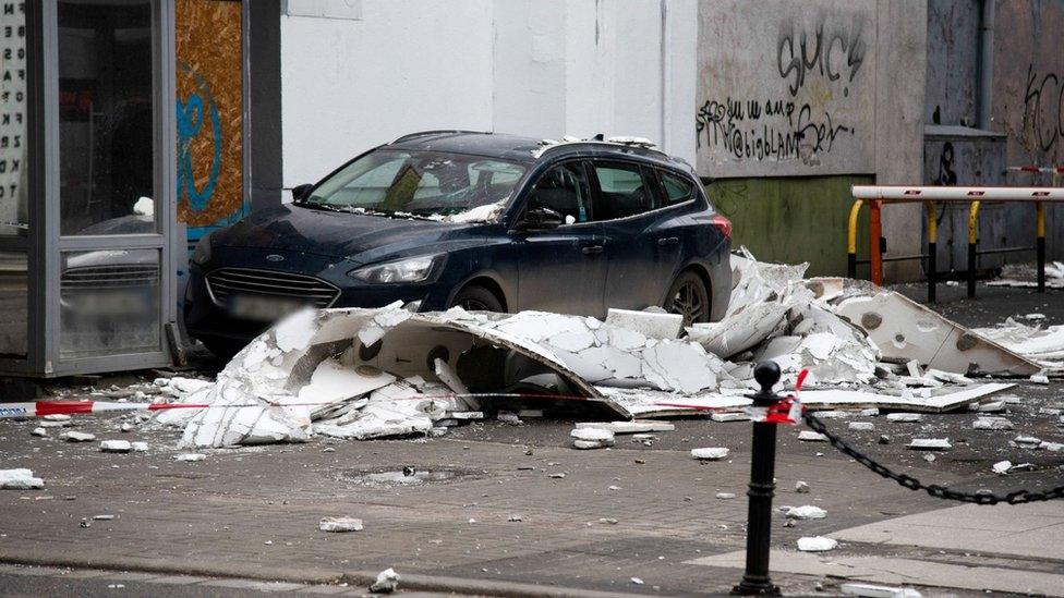 A car surrounded by fallen debris in Poznan