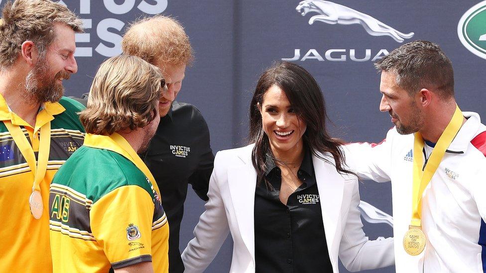 Prince Harry and Meghan hand out the first medals of this year's Invictus Games