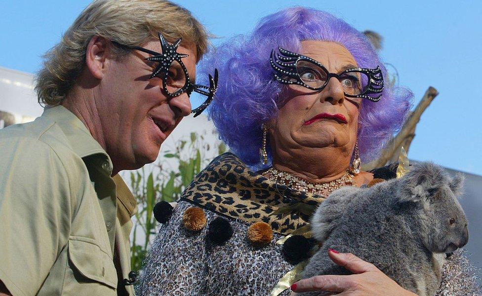 Steve Irwin and Dame Edna Everage at an official naming ceremony for a baby koala.