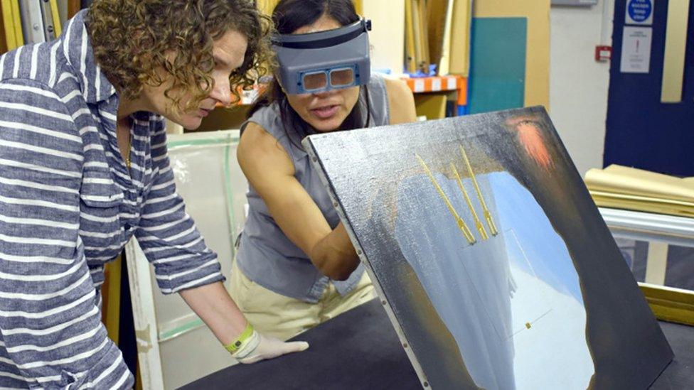 Norwich Castle historic art curator Giorgia Bottinelli (left) and conservator Alice Tavares with the painting