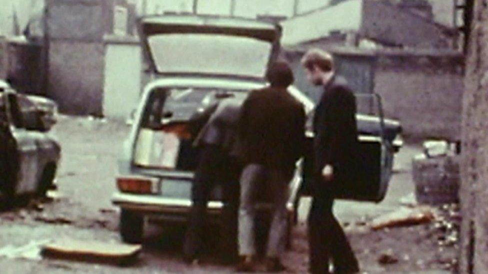 Martin McGuinness in the presence of people assembling a car bomb in 1972