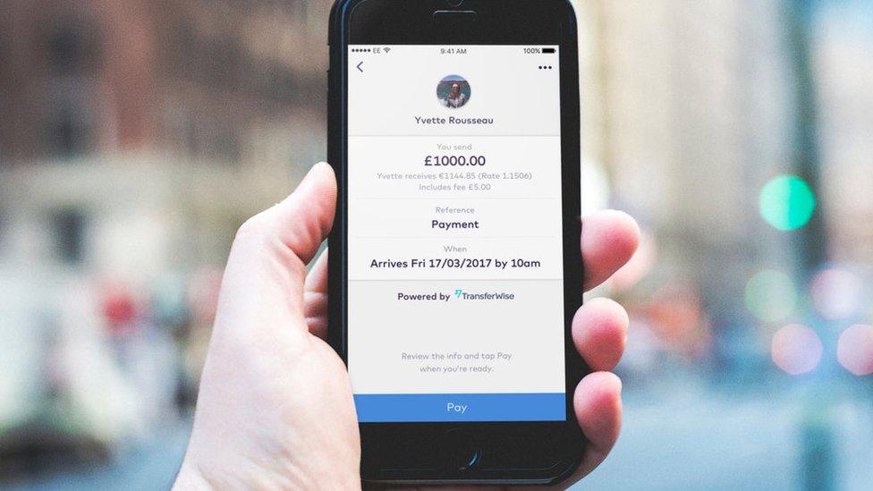 Mobile phone showing TransferWise money transaction