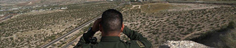 A US Border Patrol agent scans the US-Mexico border on 3 October