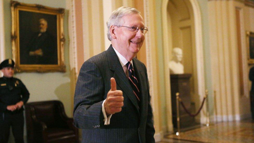 Senate Majority Leader Mitch McConnell (R-KY) gives the thumbs-up to the media after the Senate voted to confirm Betsy DeVos as education secretary on Capitol Hill on February 7, 2017 in Washington, D.C.