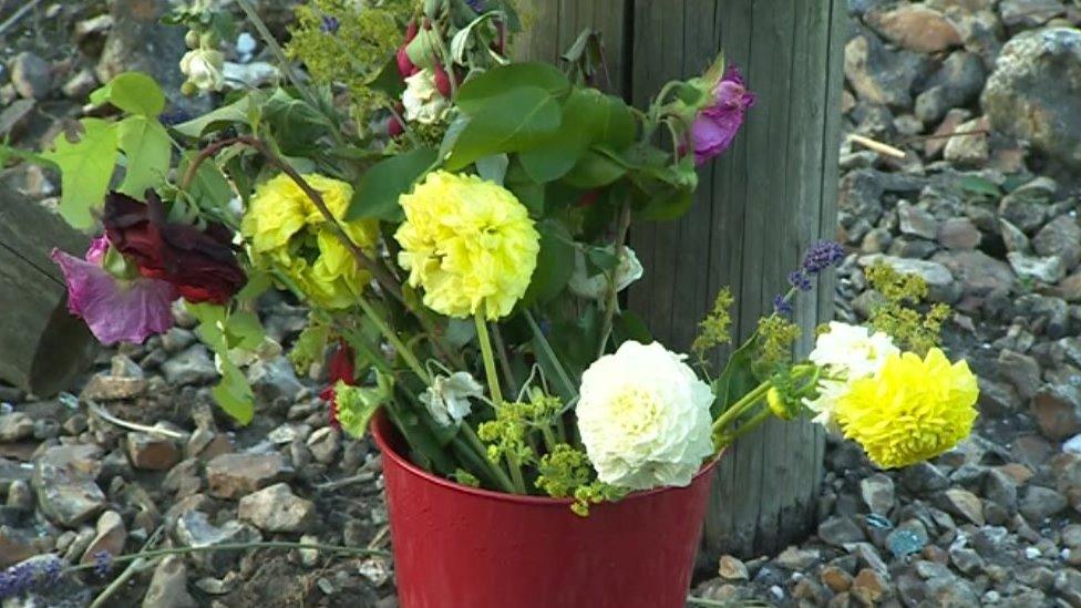 Flowers at the scene of the crash