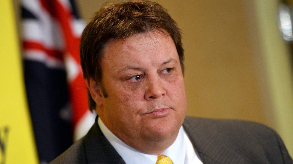 Senator Glenn Lazarus of the Palmer United Party (PUP) listens during a press conference, in Sydney on October 10, 2013.