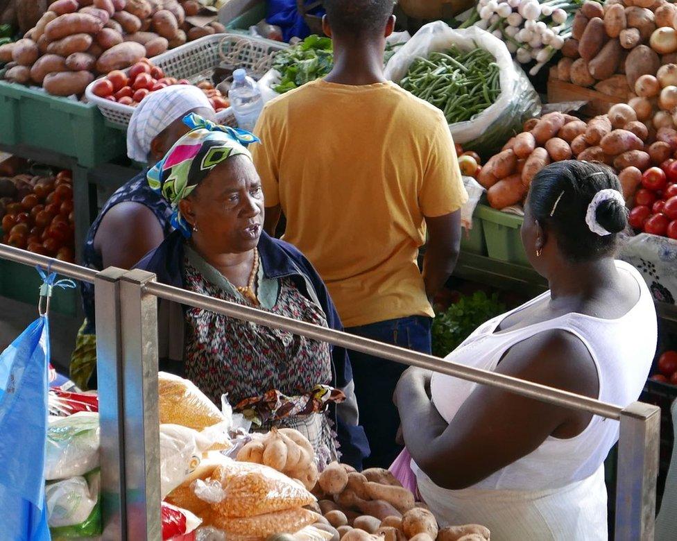 Women selling vegetables on a marketplace in Praia, the largest city in Cape Verde