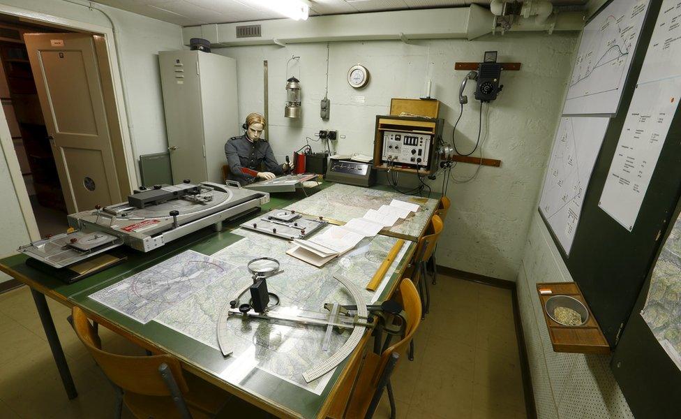 An artillery control room is seen in a bunker at a former artillery fort in the town of Faulensee, Switzerland