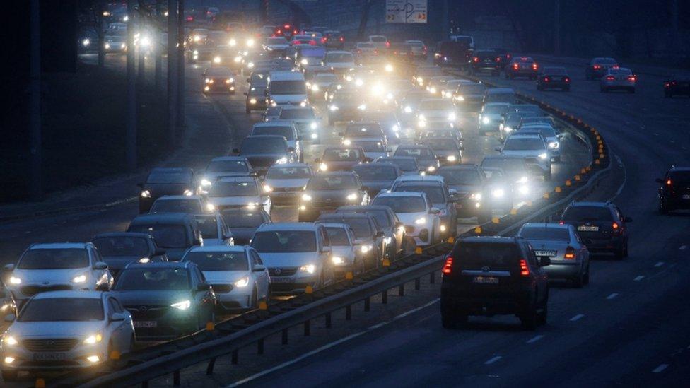 Cars drive towards the exit of the city after Russian President Vladimir Putin authorized a military operation in eastern Ukraine, in Kyiv, Ukraine February 24, 2022