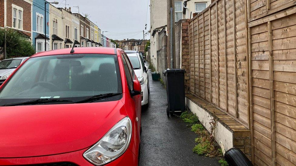 A road in Easton with lots of cars parked on the pavement