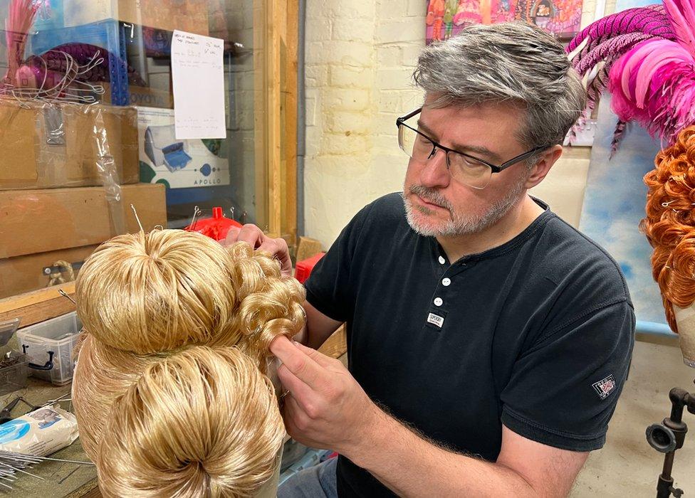 David Robbins working on a wig