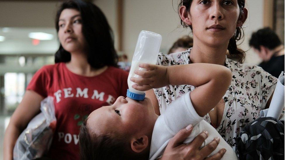 Mother holds baby