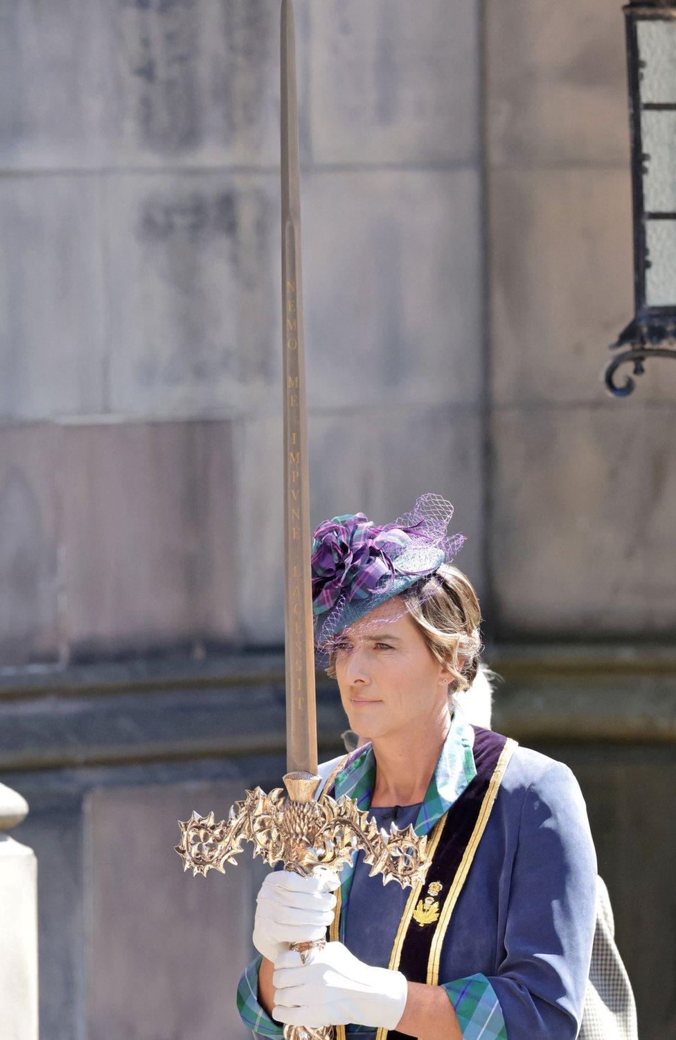 Dame Grainger carries the Elizabeth Sword into the cathedral