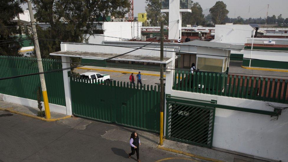 A woman walks past the compound of the Agujas immigration detention centre, where Ethan Couch is being detained in Mexico City, 31 December 2015