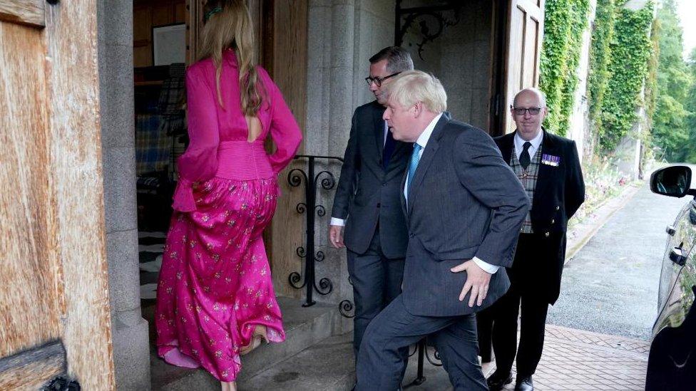 Boris Johnson, with his wife Carrie Johnson, arrives for an audience with Britain's Queen Elizabeth to formally resign as prime minister, at Balmoral