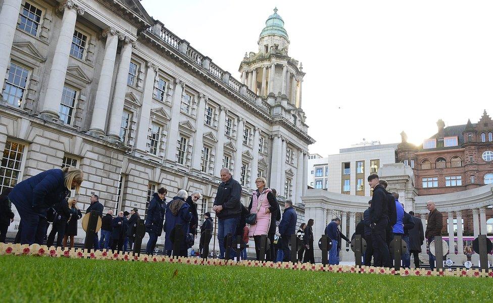 Small wooden crosses have been placed outside Belfast City Hall in memory of fallen soldiers