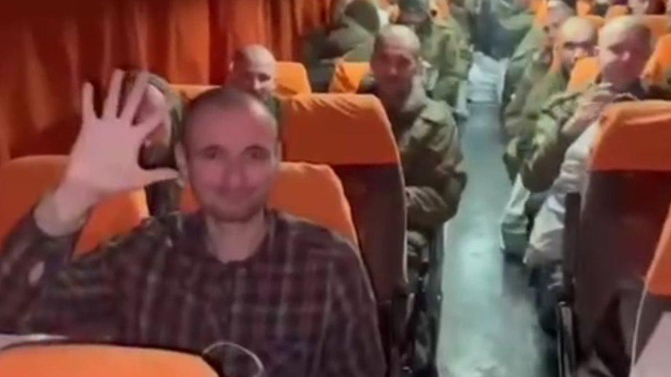 Russian officials posted footage of their released prisoners returning home on a bus