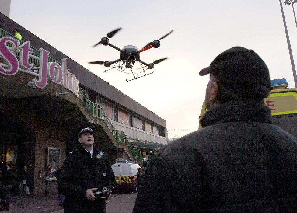 Police officer using a drone in Liverpool in December 2007